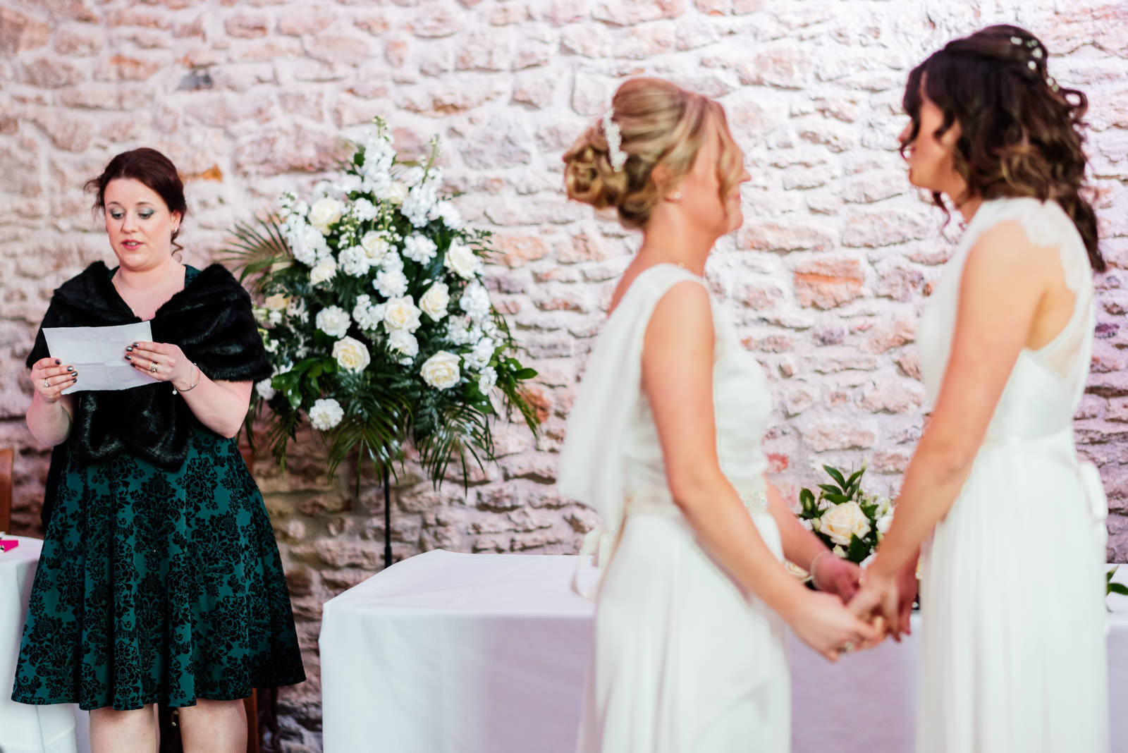 brides listening to reading during wedding ceremony