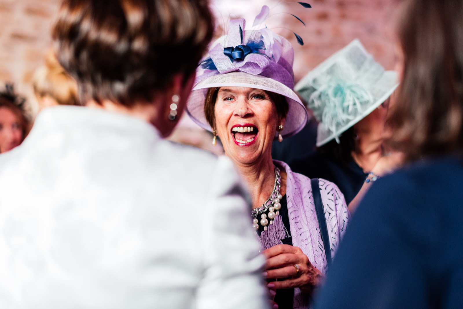 Guest laughing at wedding