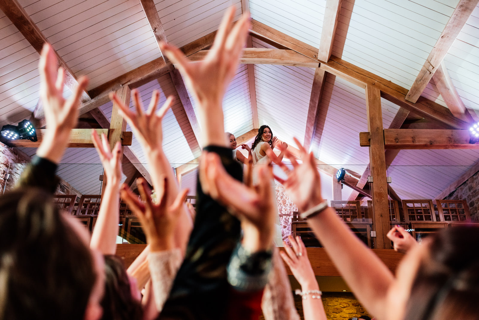 guests trying to catch the bouquet