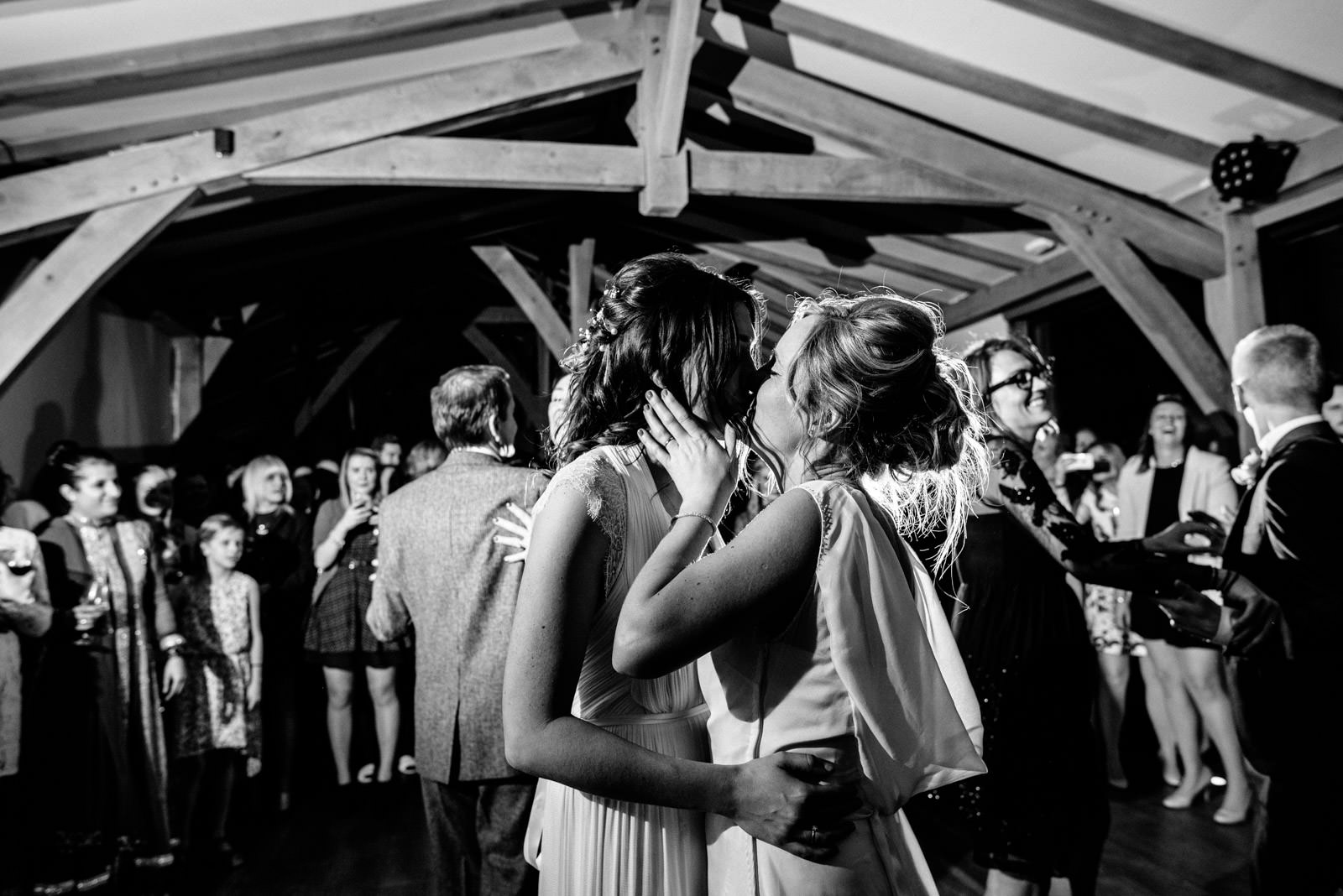 Brides kiss during first dance