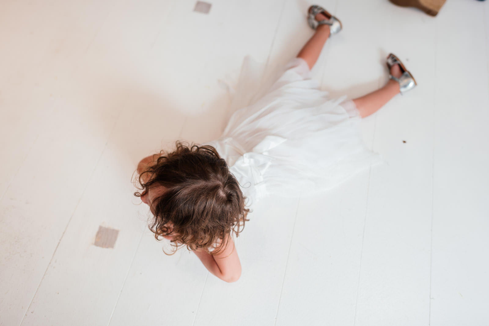 flower girl lying on the ground