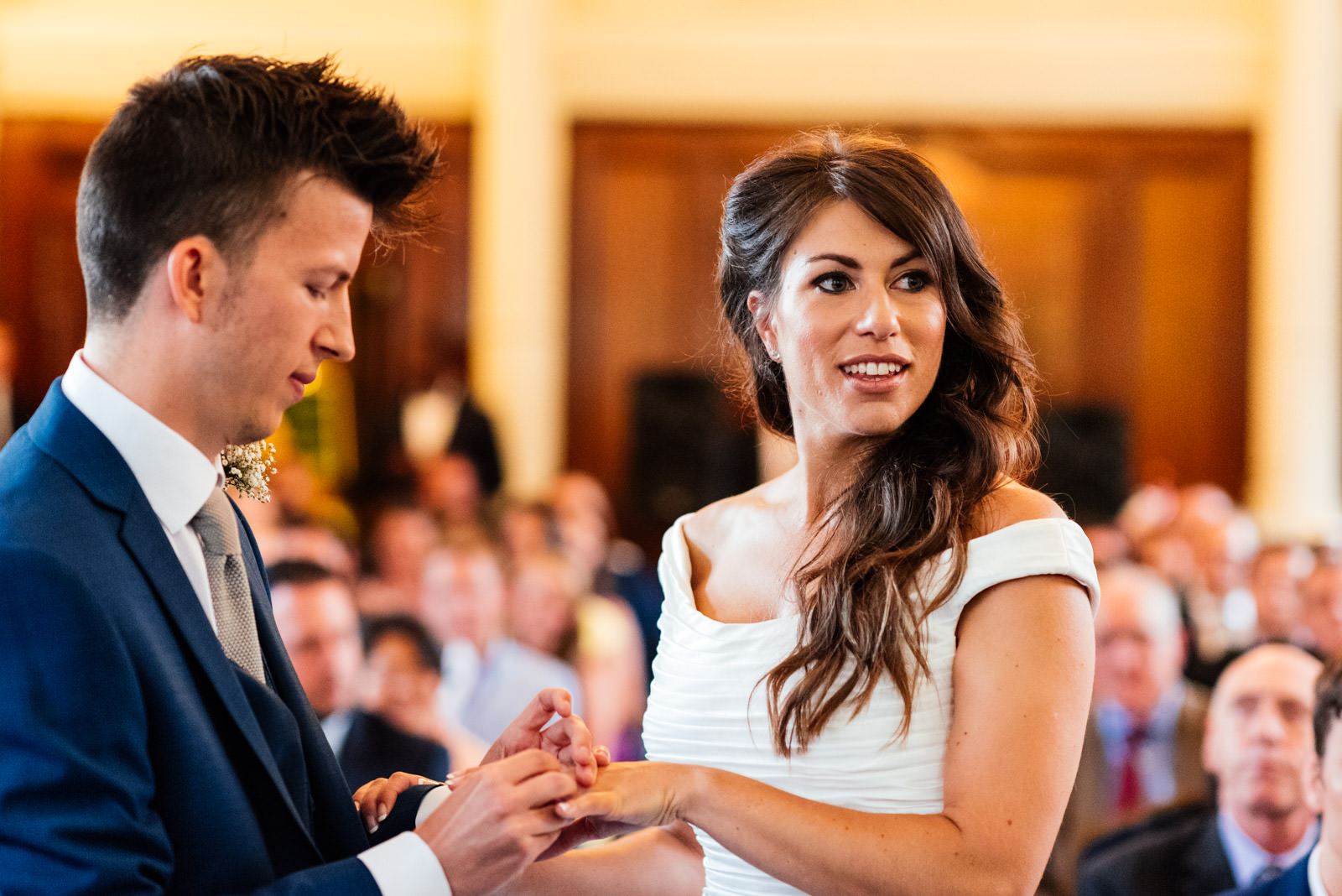 bride and groom exchanging rings