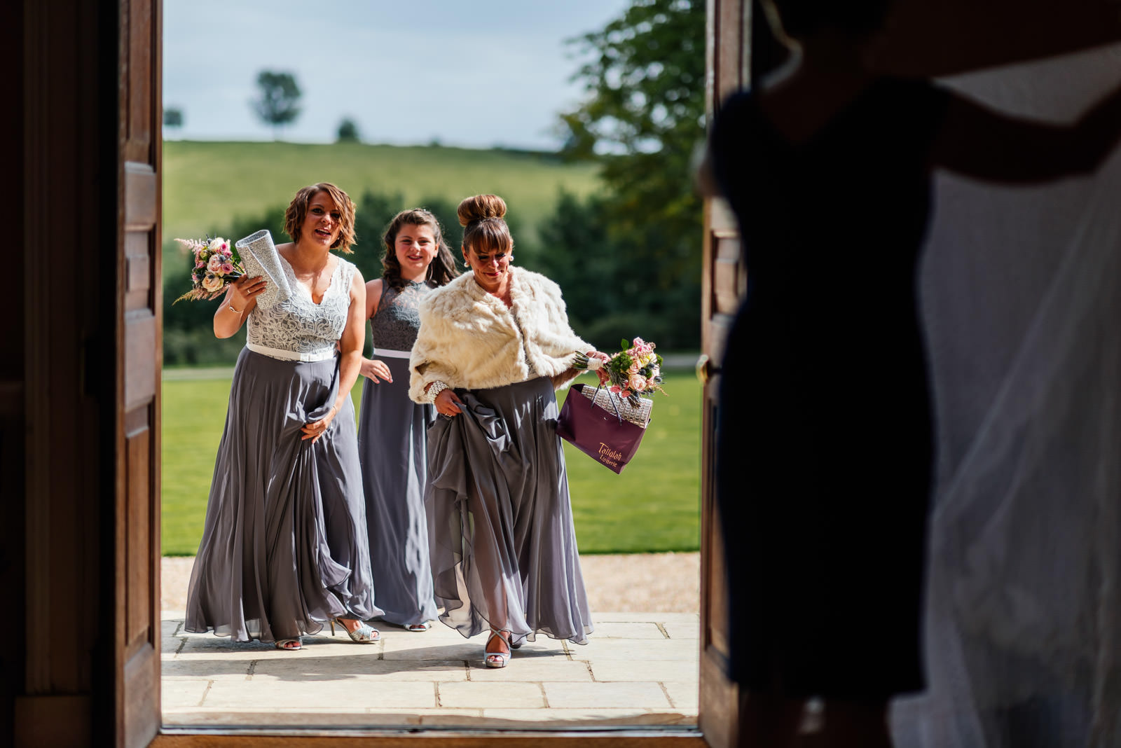 bridesmaids arriving at Kelmarsh Hall