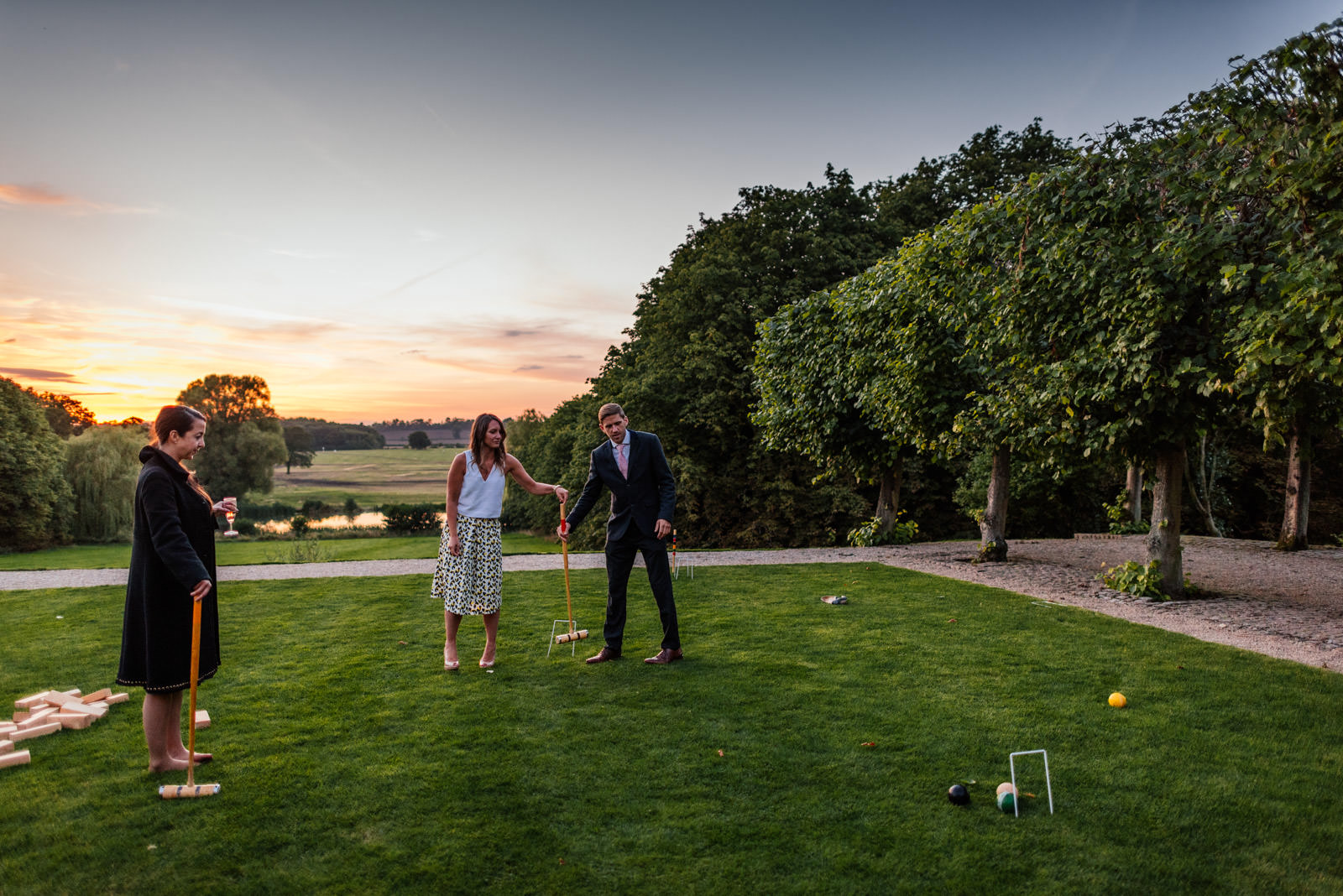 guests playing garden games in the evening