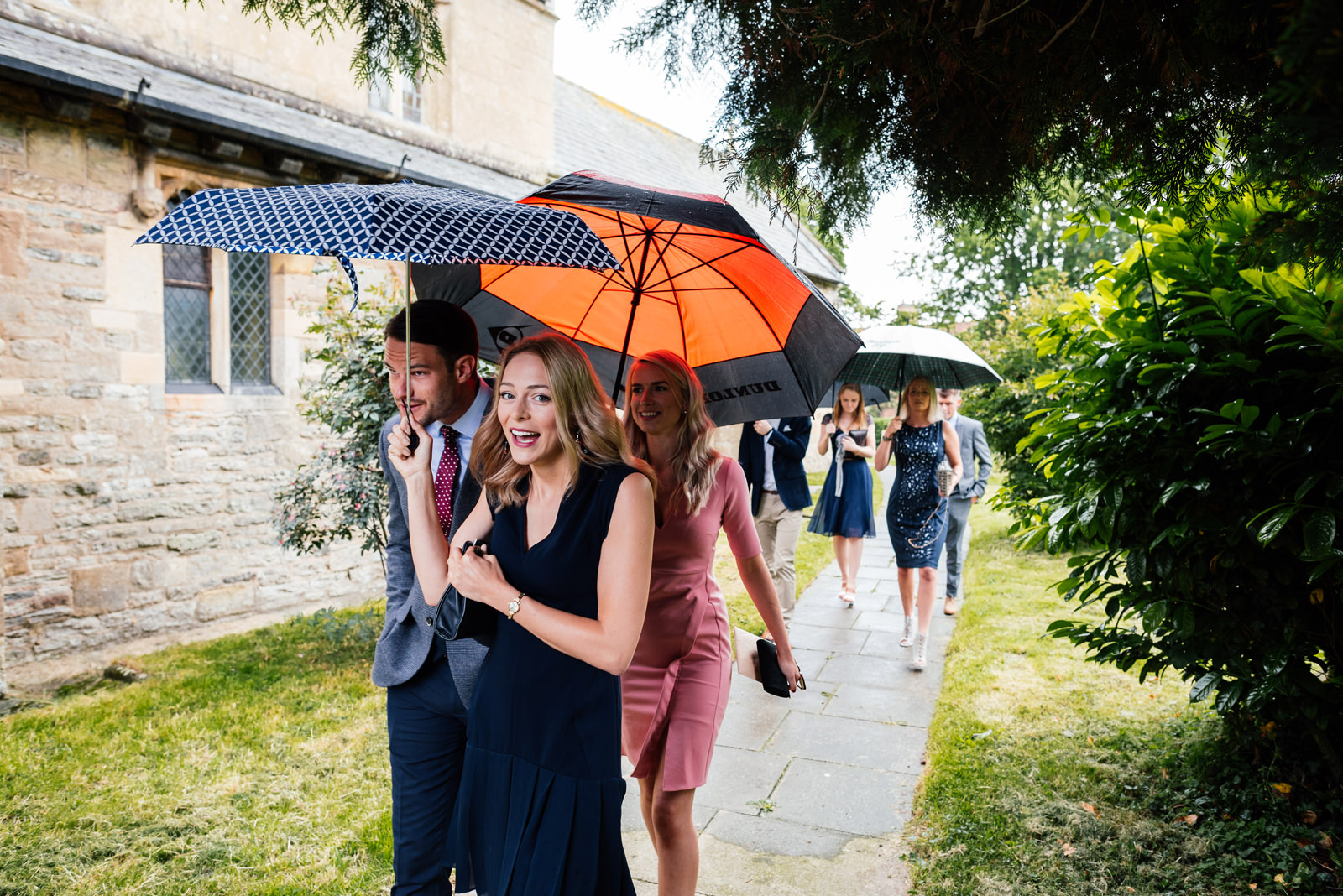 guests arriving in the rain