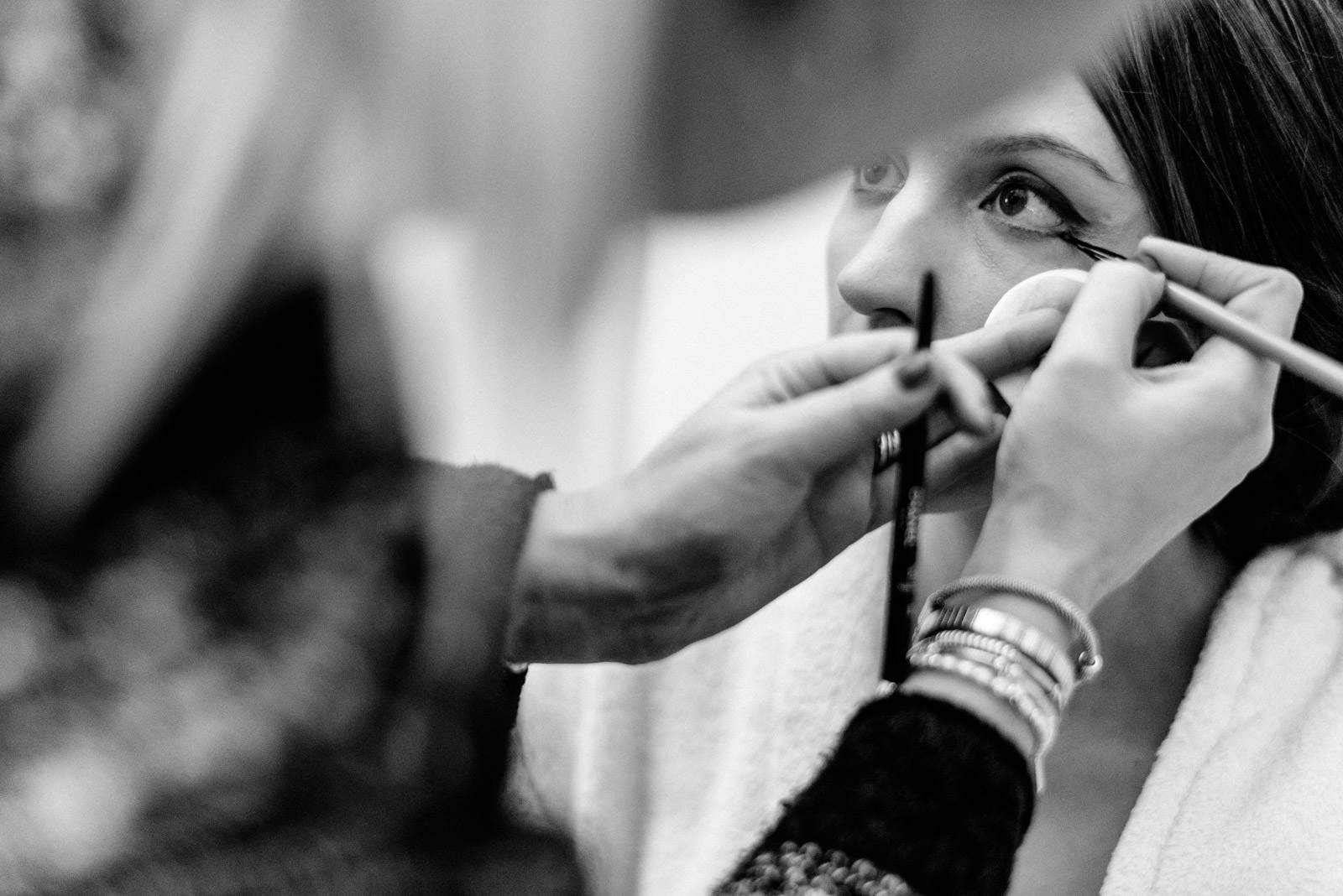 bride having making up done