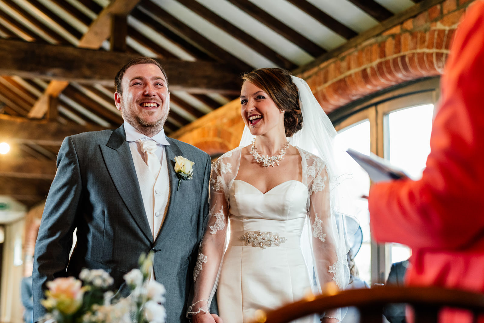 bride and groom laughing