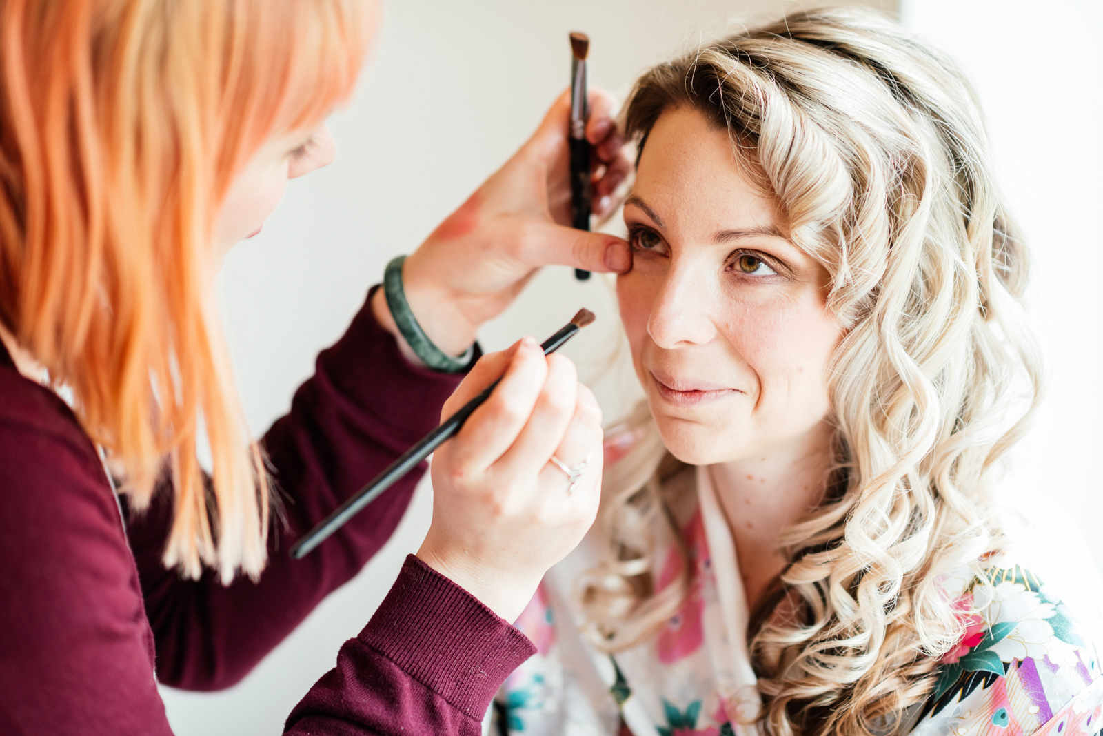 make-up being applied to bride
