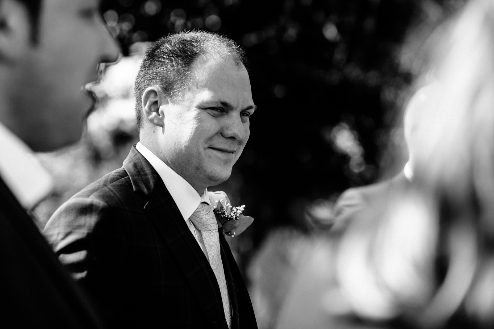 black and white image of groom