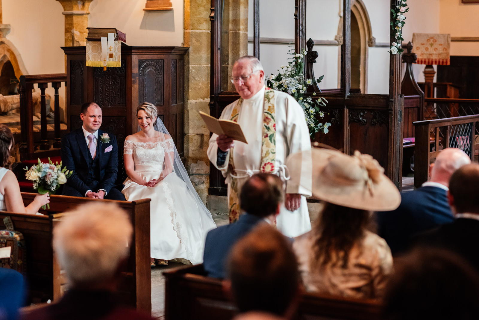 vicar doing a reading in church