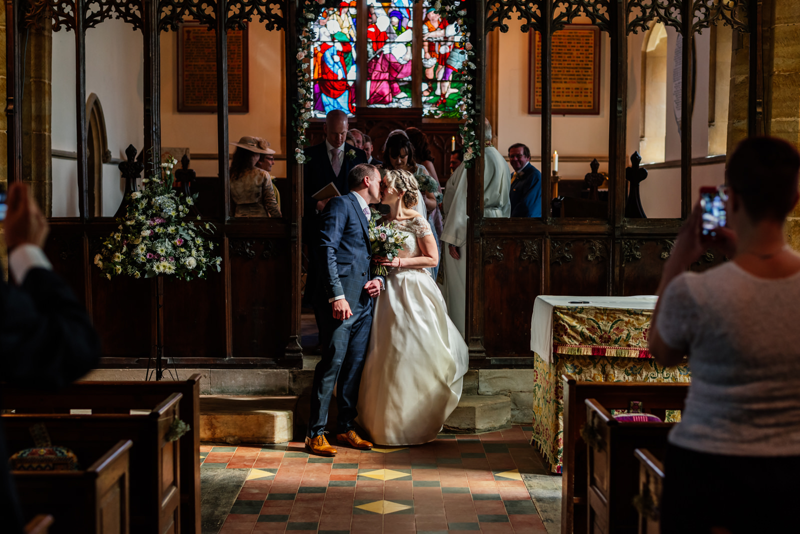 bride and groom leaving the church