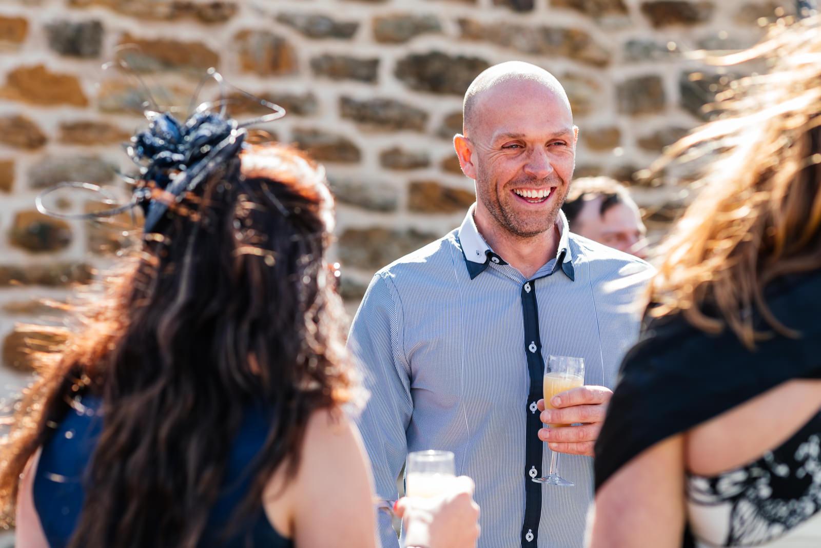 guest laughing during drinks reception