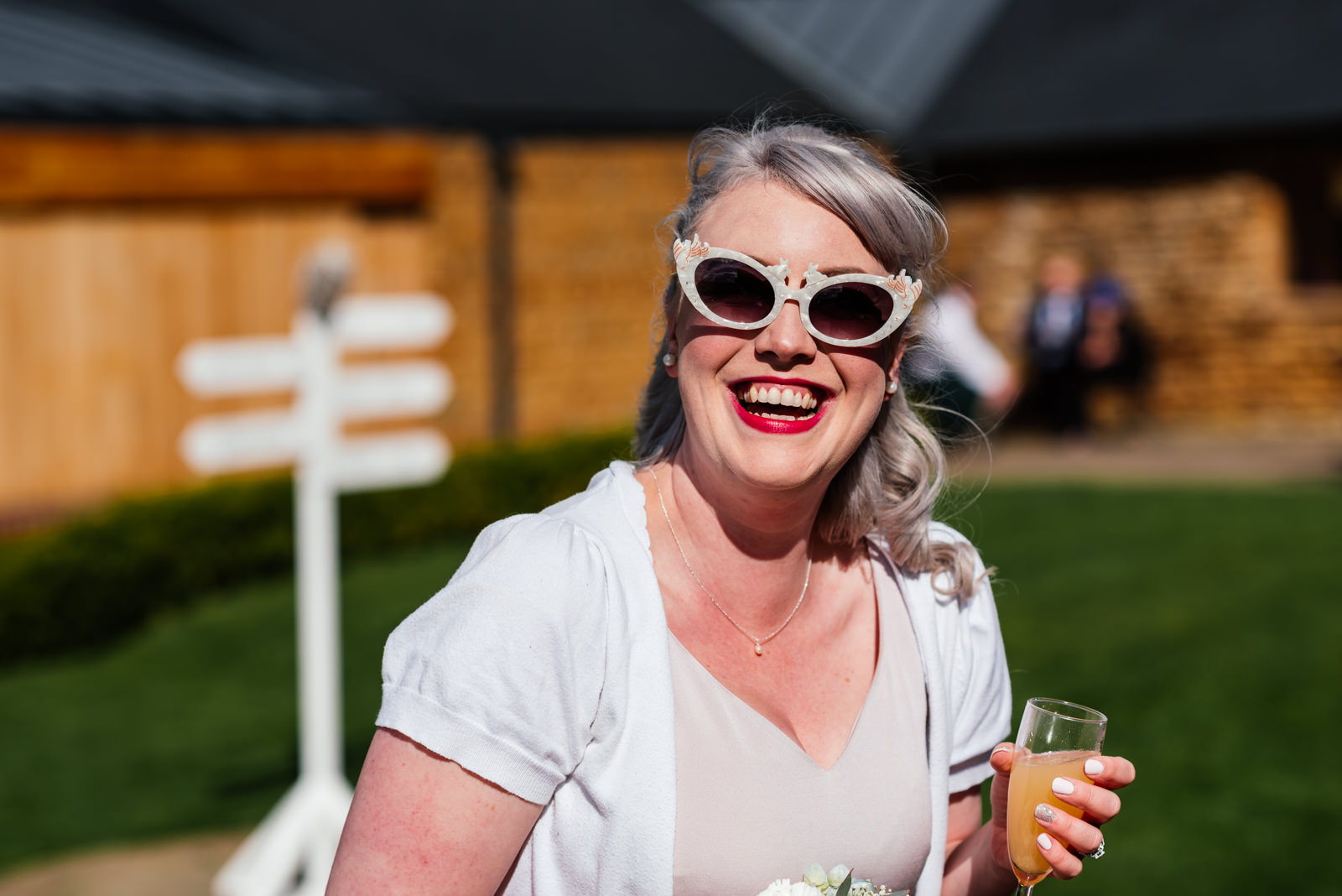 bridesmaid with sunglasses on smiling