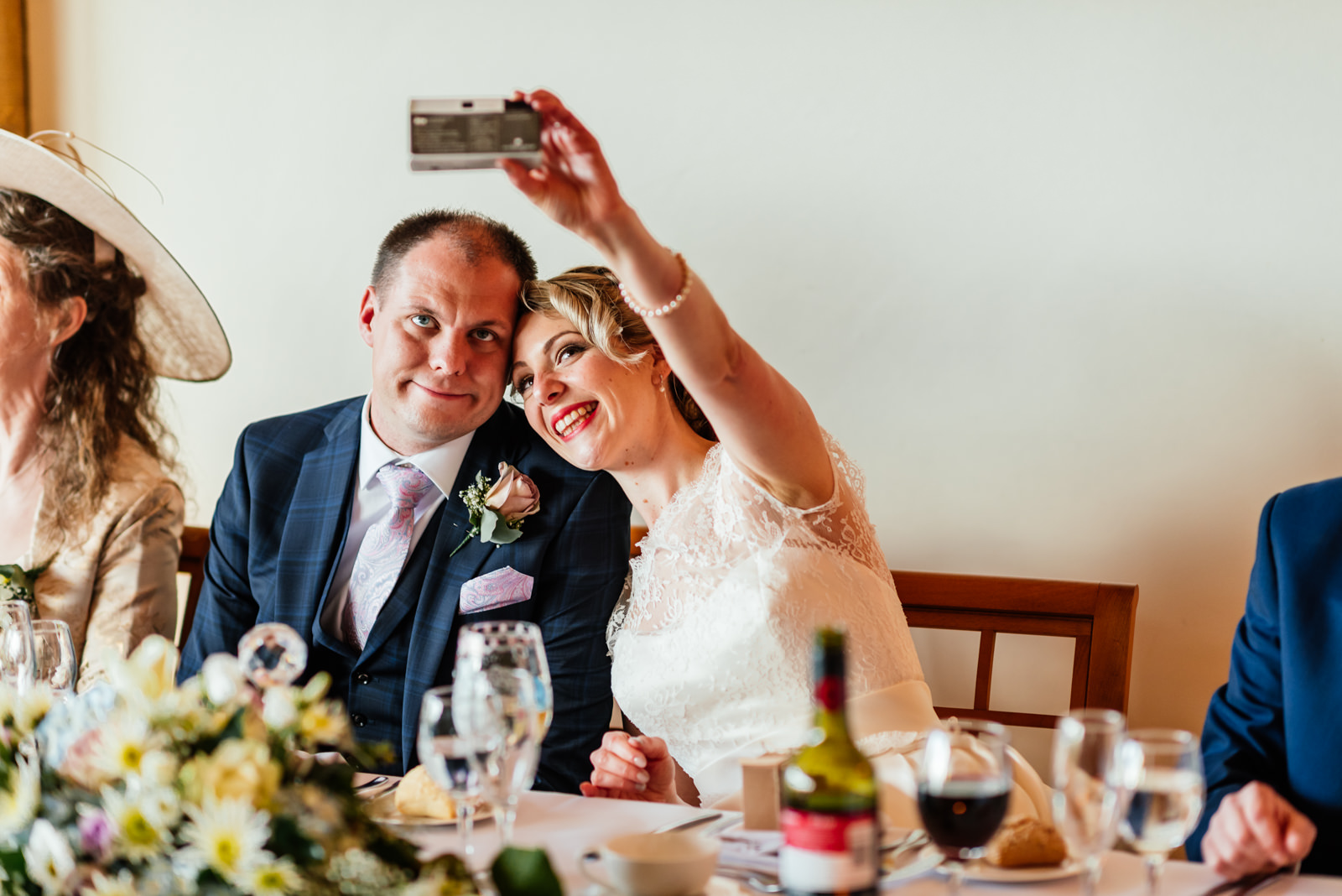 bride and groom take selfie