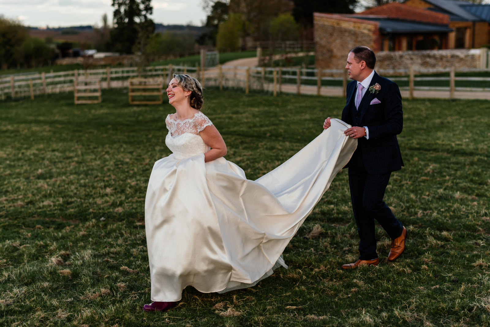 bride and groom walking in dodford field