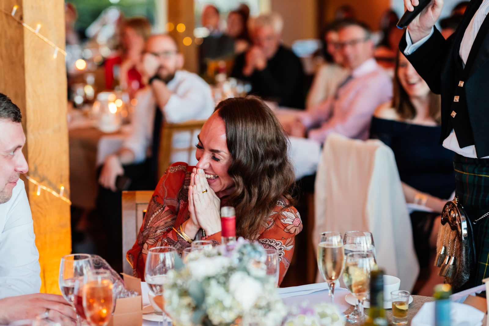 guest laughing at speeches