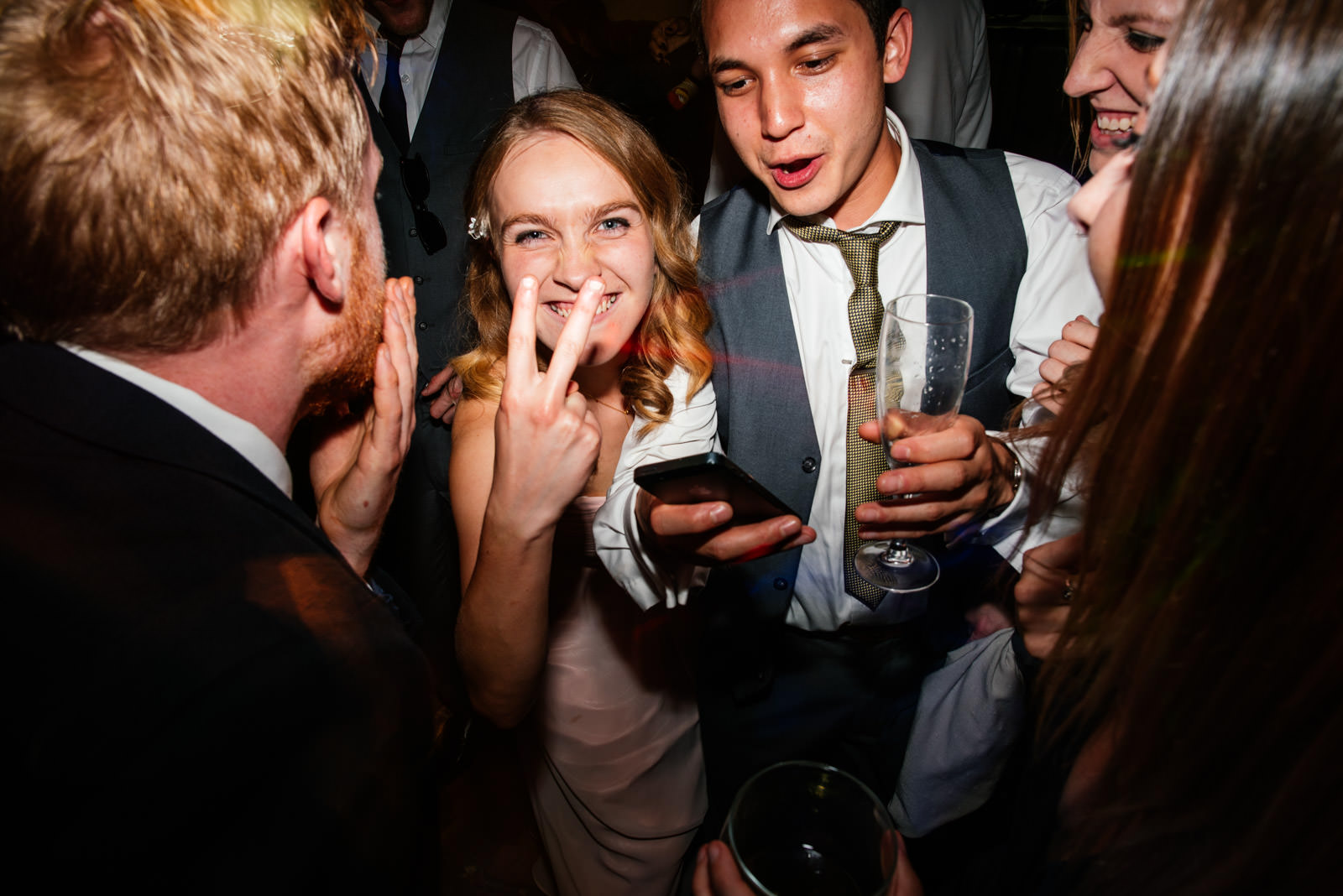 bridesmaid sticking two fingers up