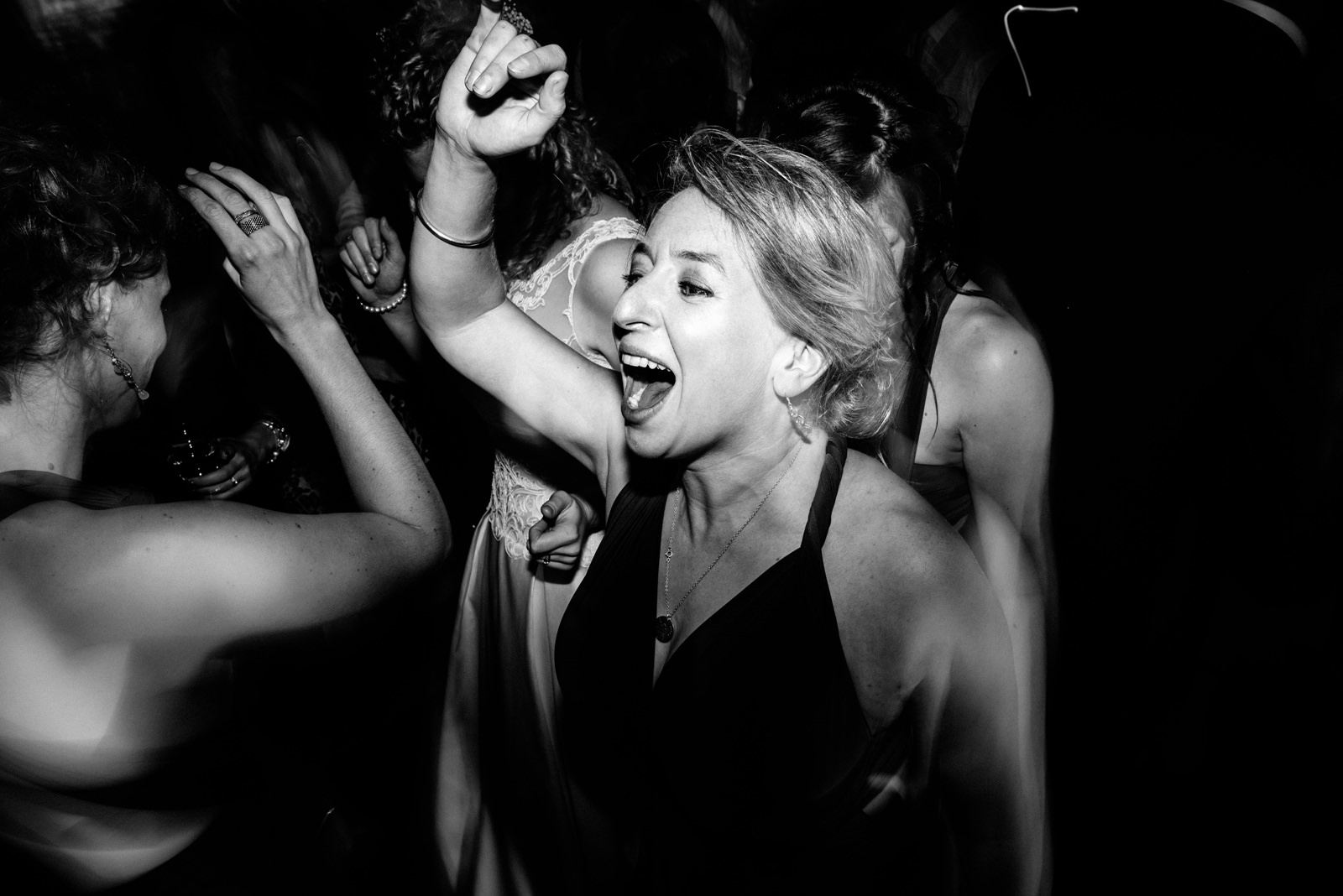 Bridesmaid throwing shapes on the dance floor