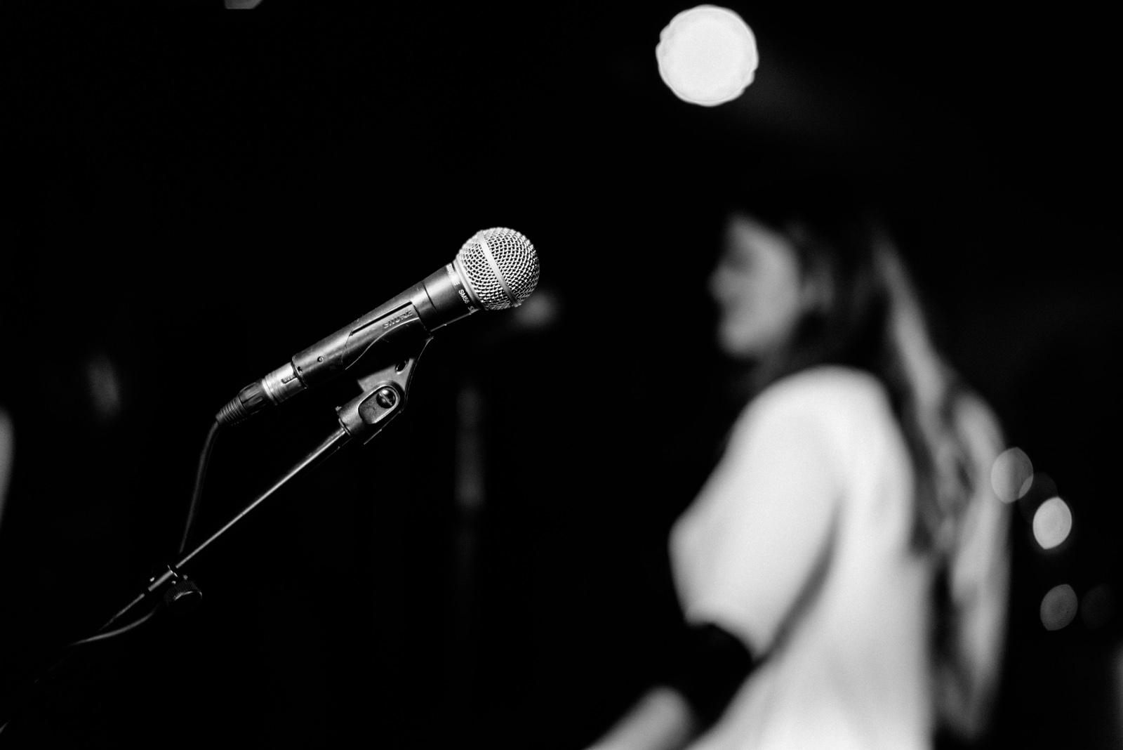 its a black and white photo of a microphone... at a wedding