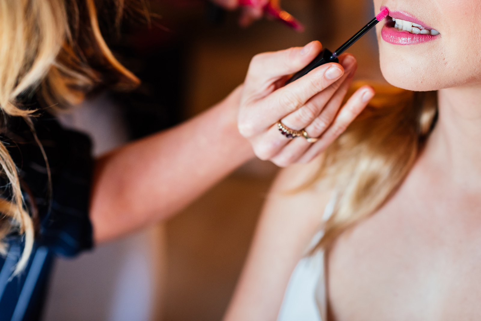 Bridal make up being done lip stick