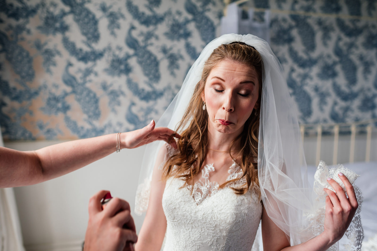 Bride getting sprayed in the face