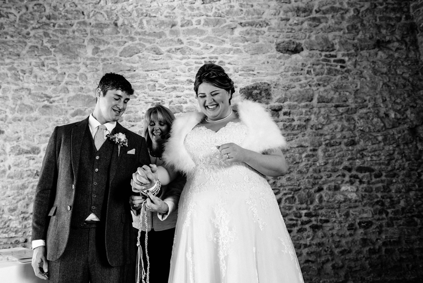 bride and groom tying the knot