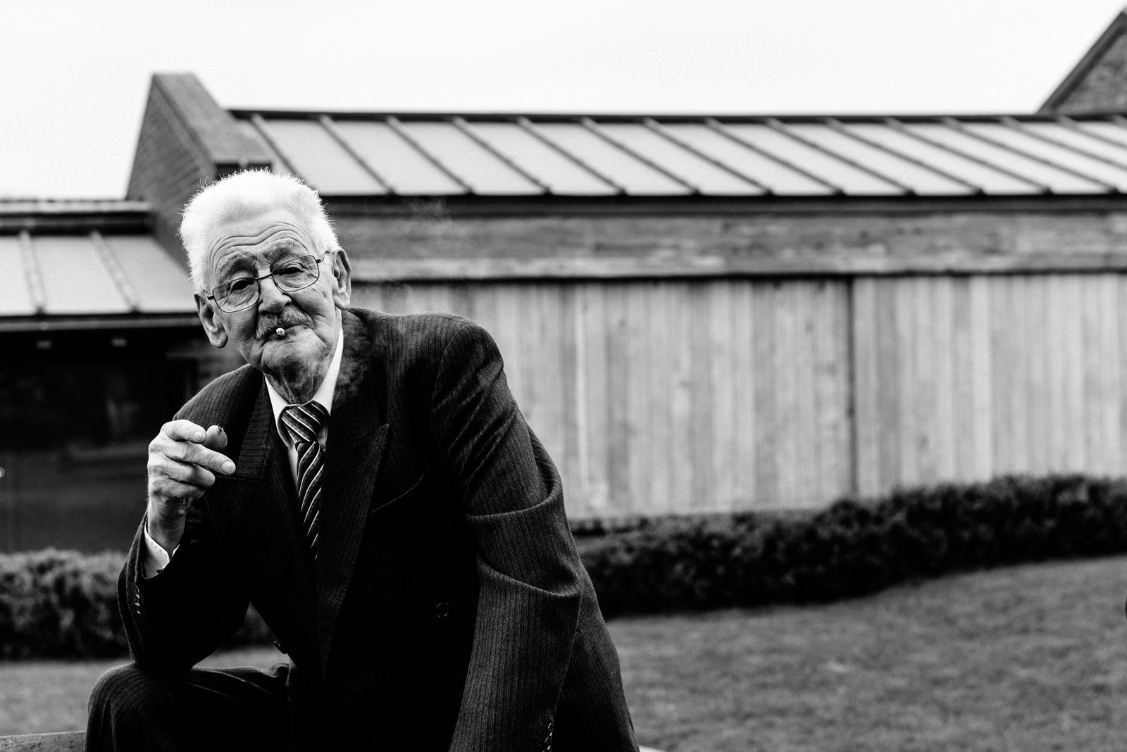 wedding guest has a cigarette