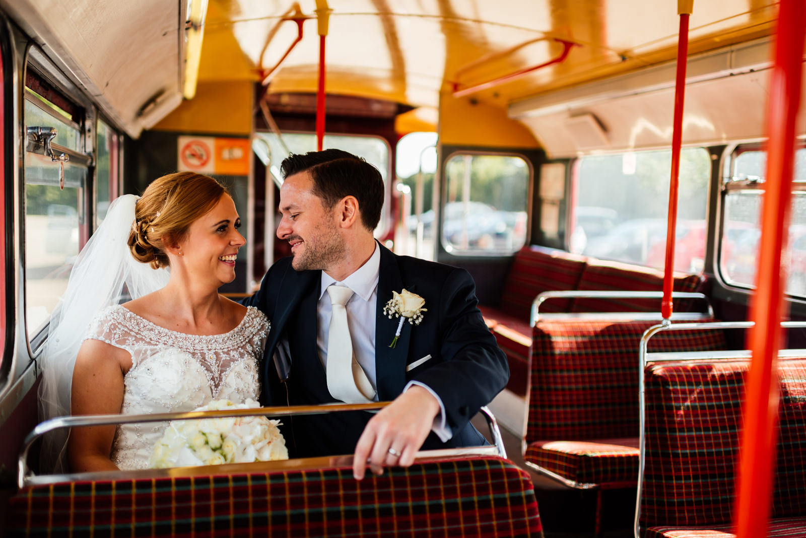 bride and groom on the bus
