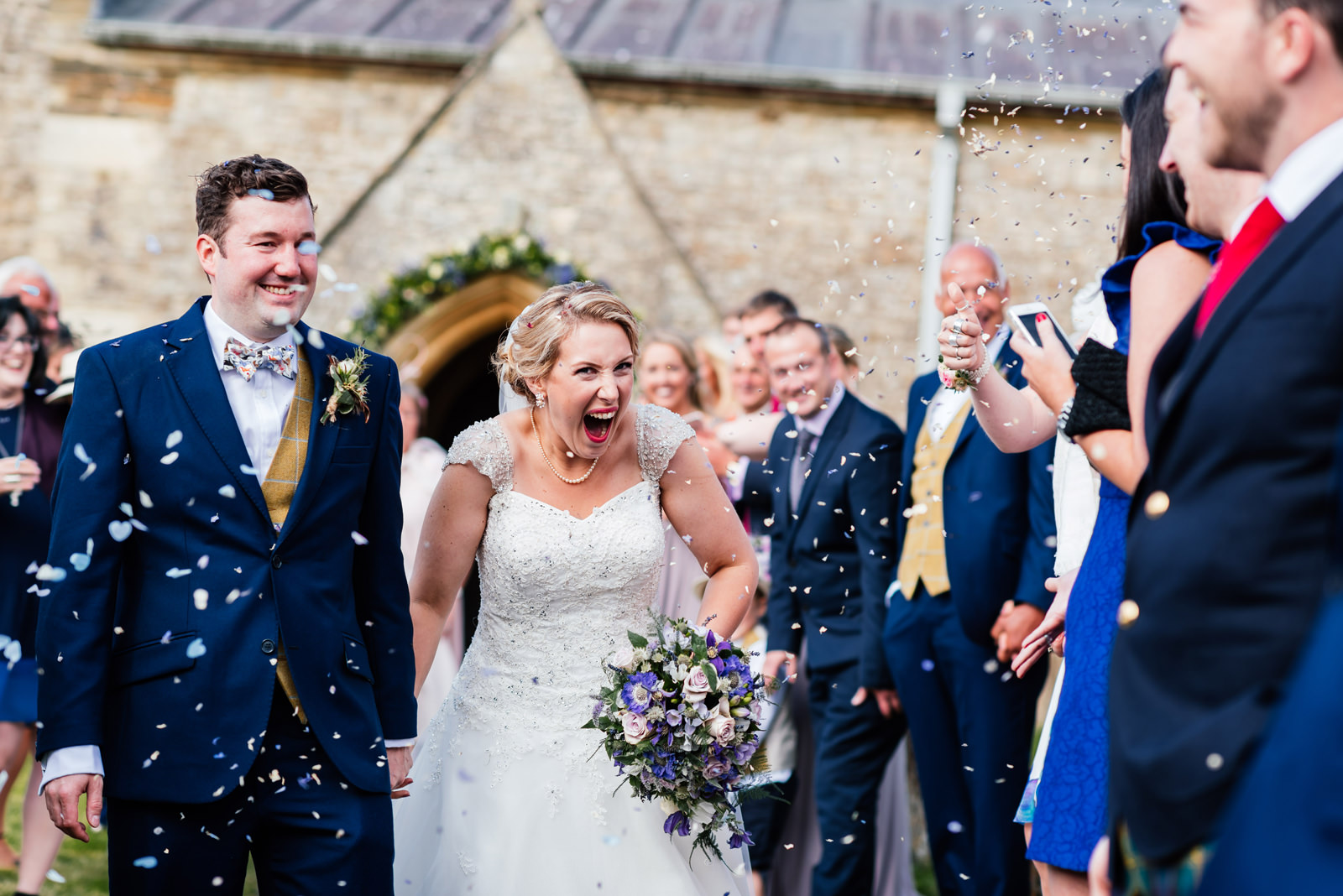 bride being pelted with confetti