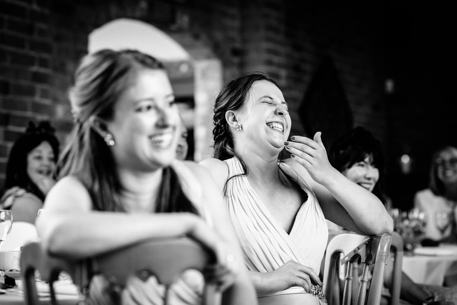 bridesmaid laughing at speeches