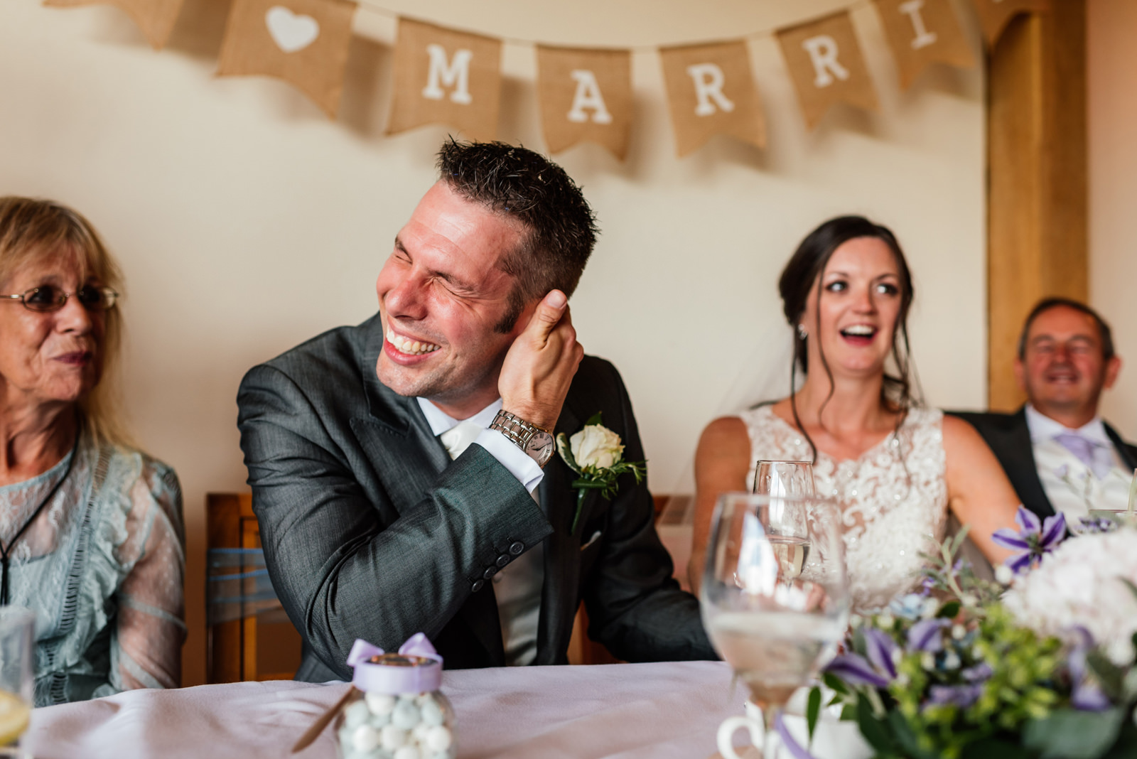 groom embarrassed during the best man speech