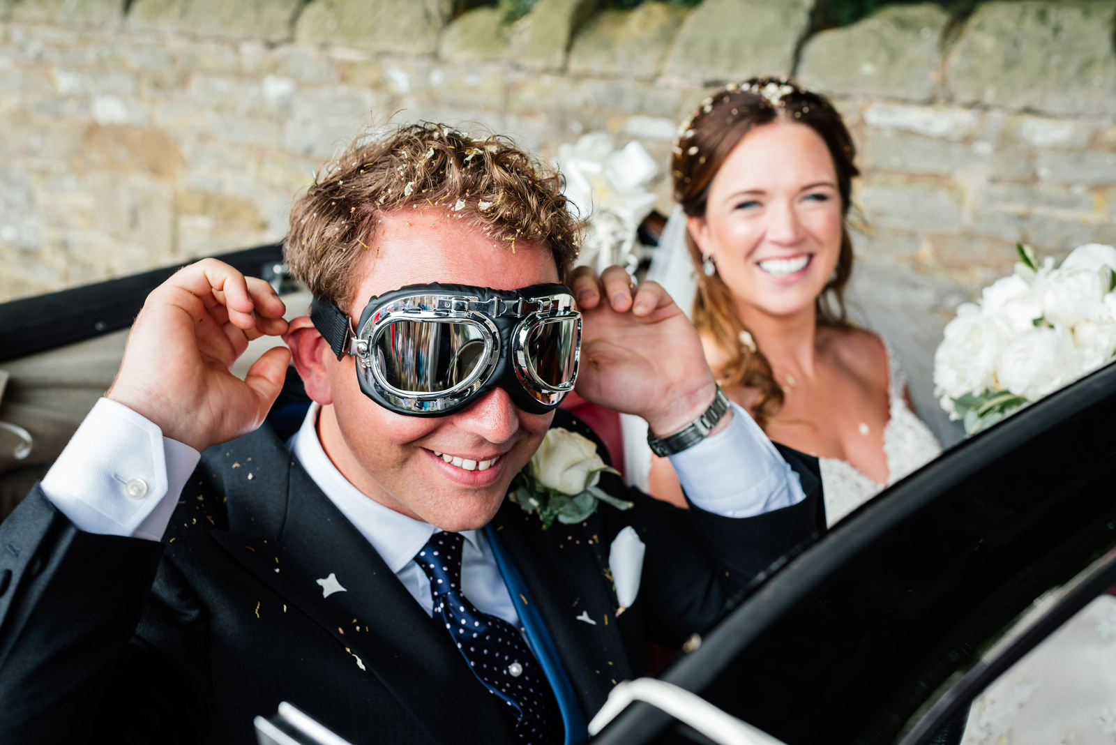 groom in his driving goggles