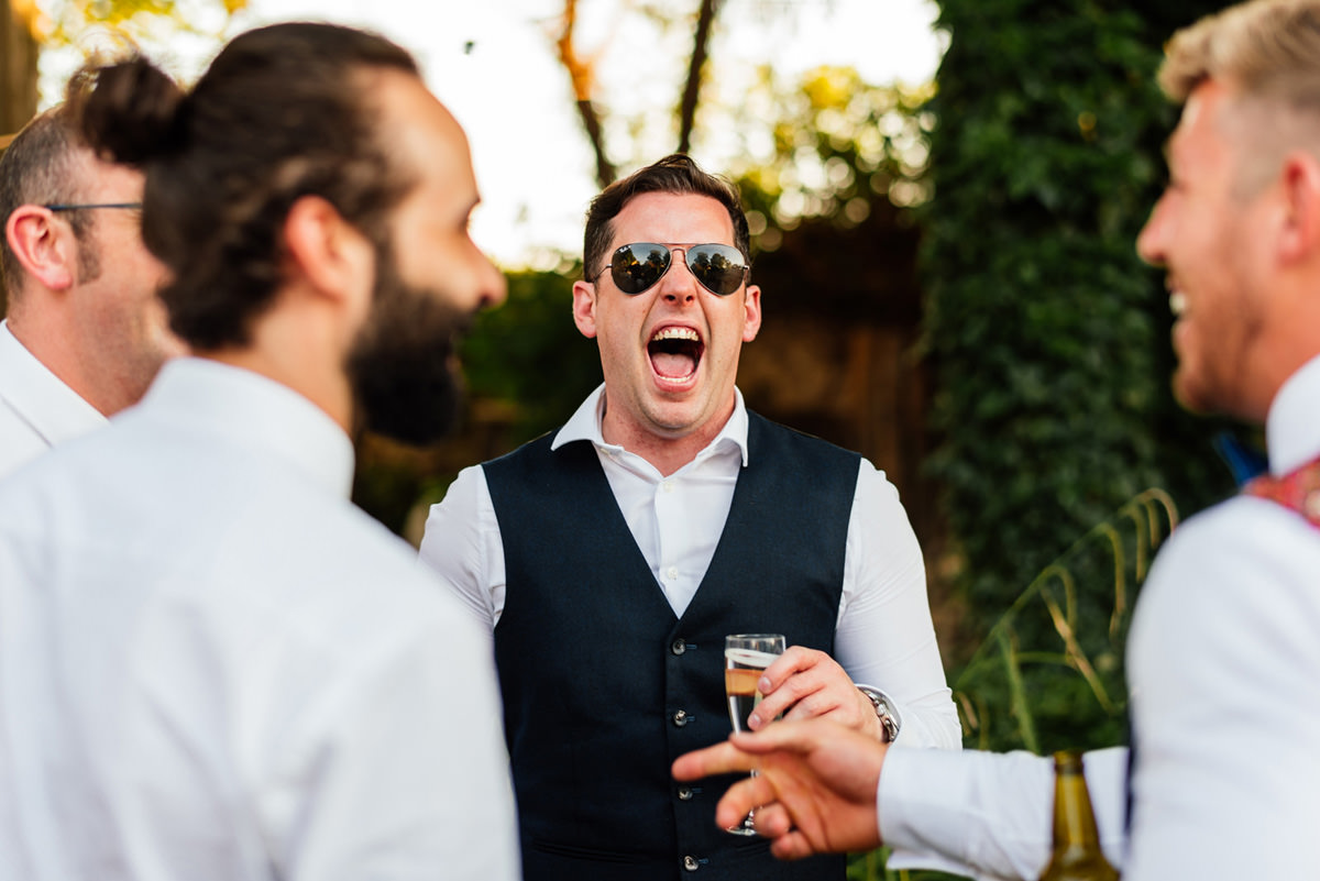 wedding guest laughing
