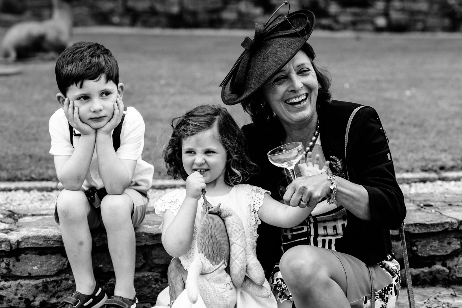 children smiling at wedding