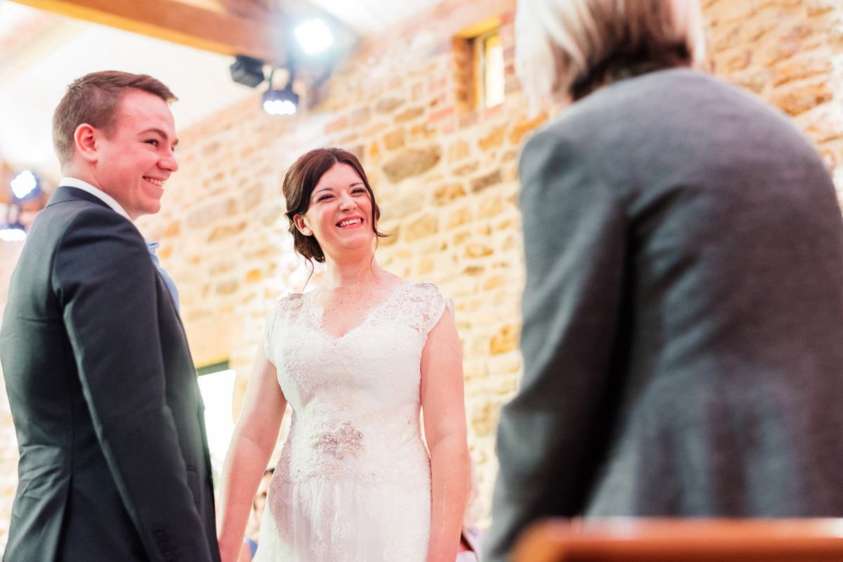 bride smiling during ceremony