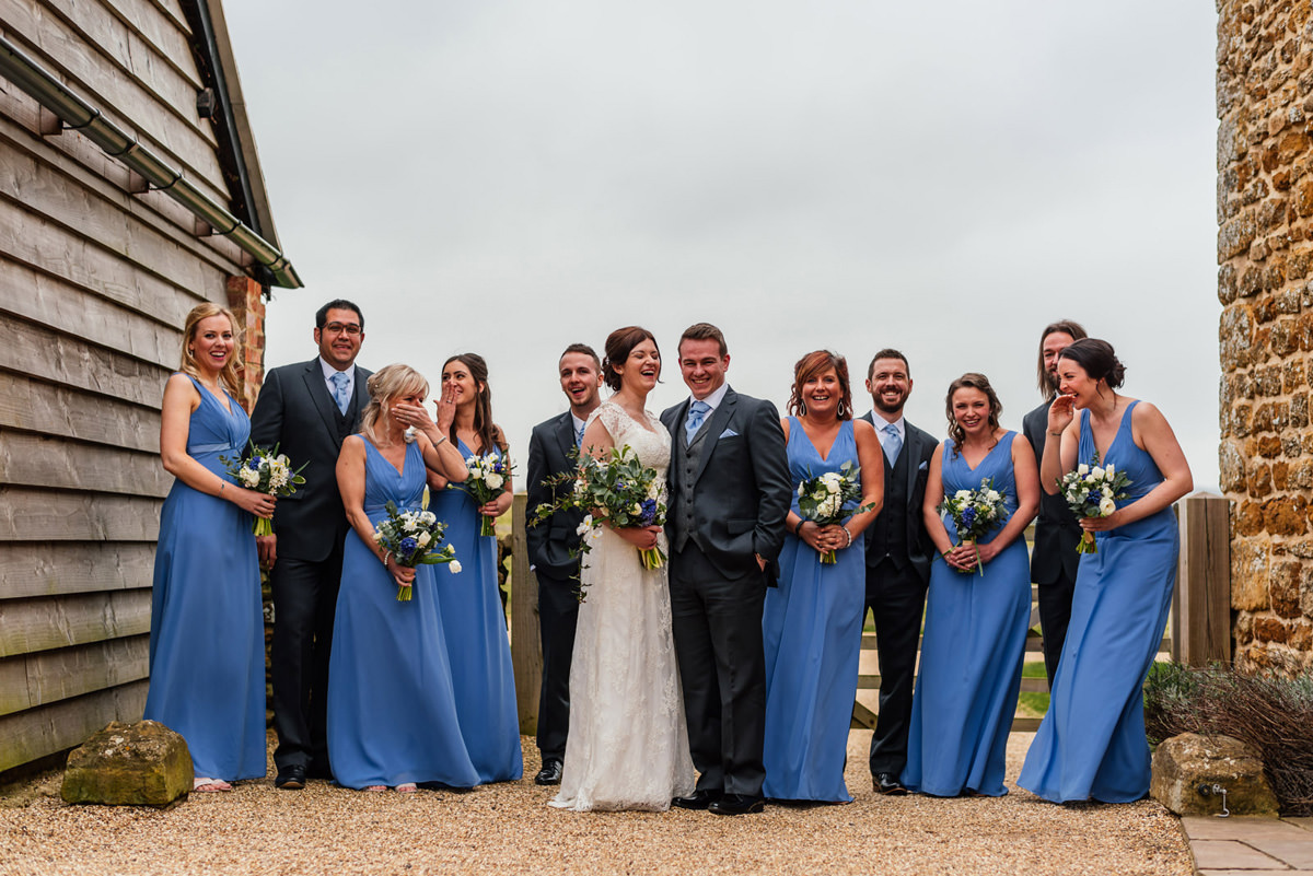 full bridal party laughing 