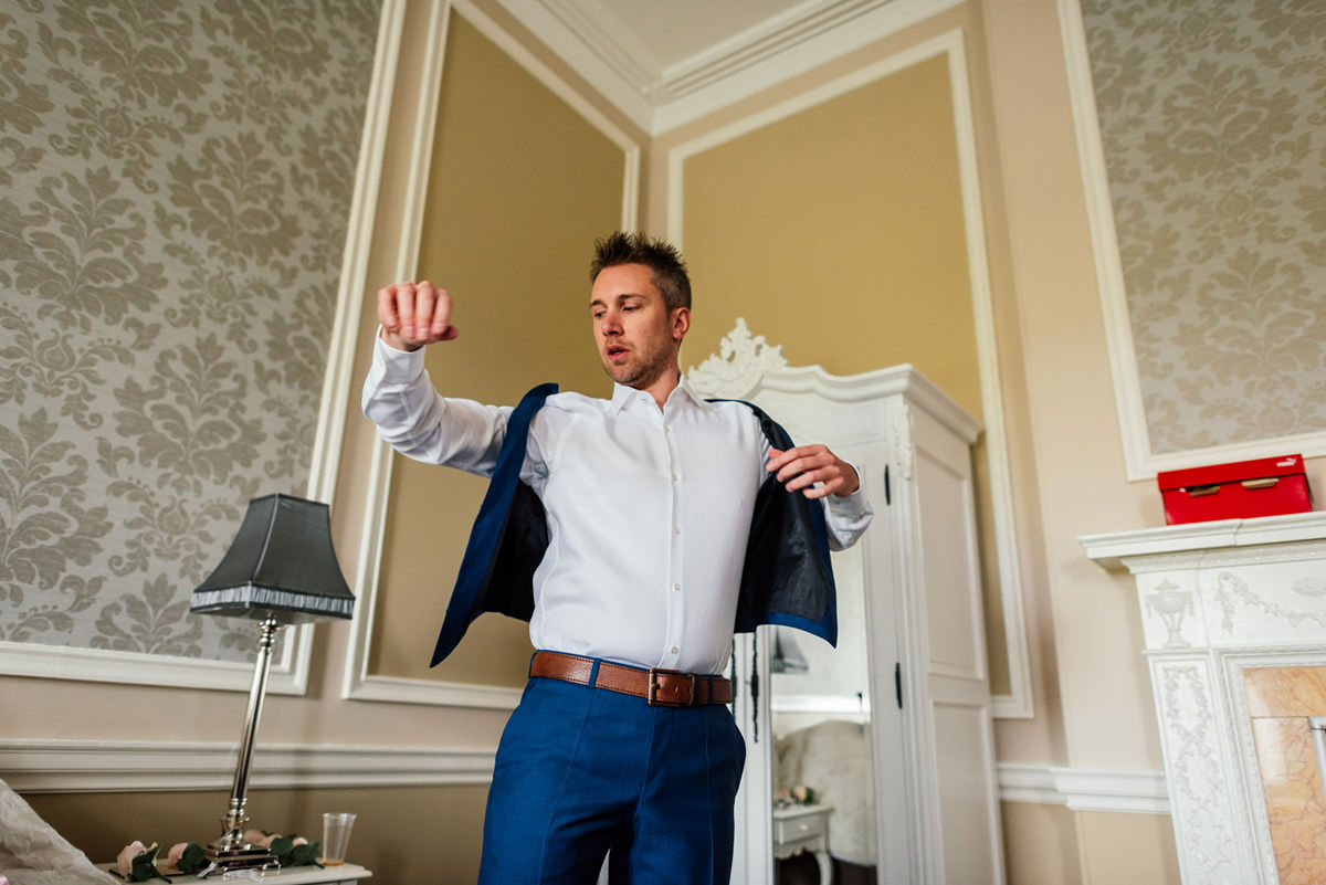 Groom getting ready on the morning of wedding
