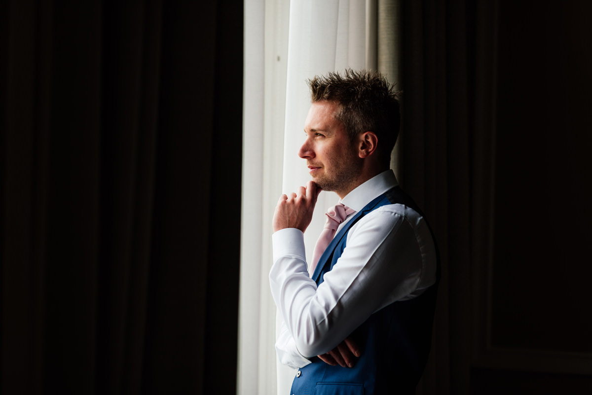 groom waiting on the morning of wedding