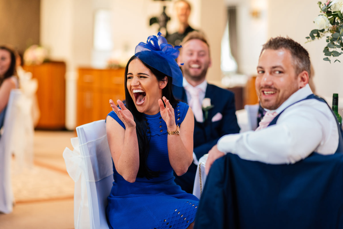 guest laughing at the speeches