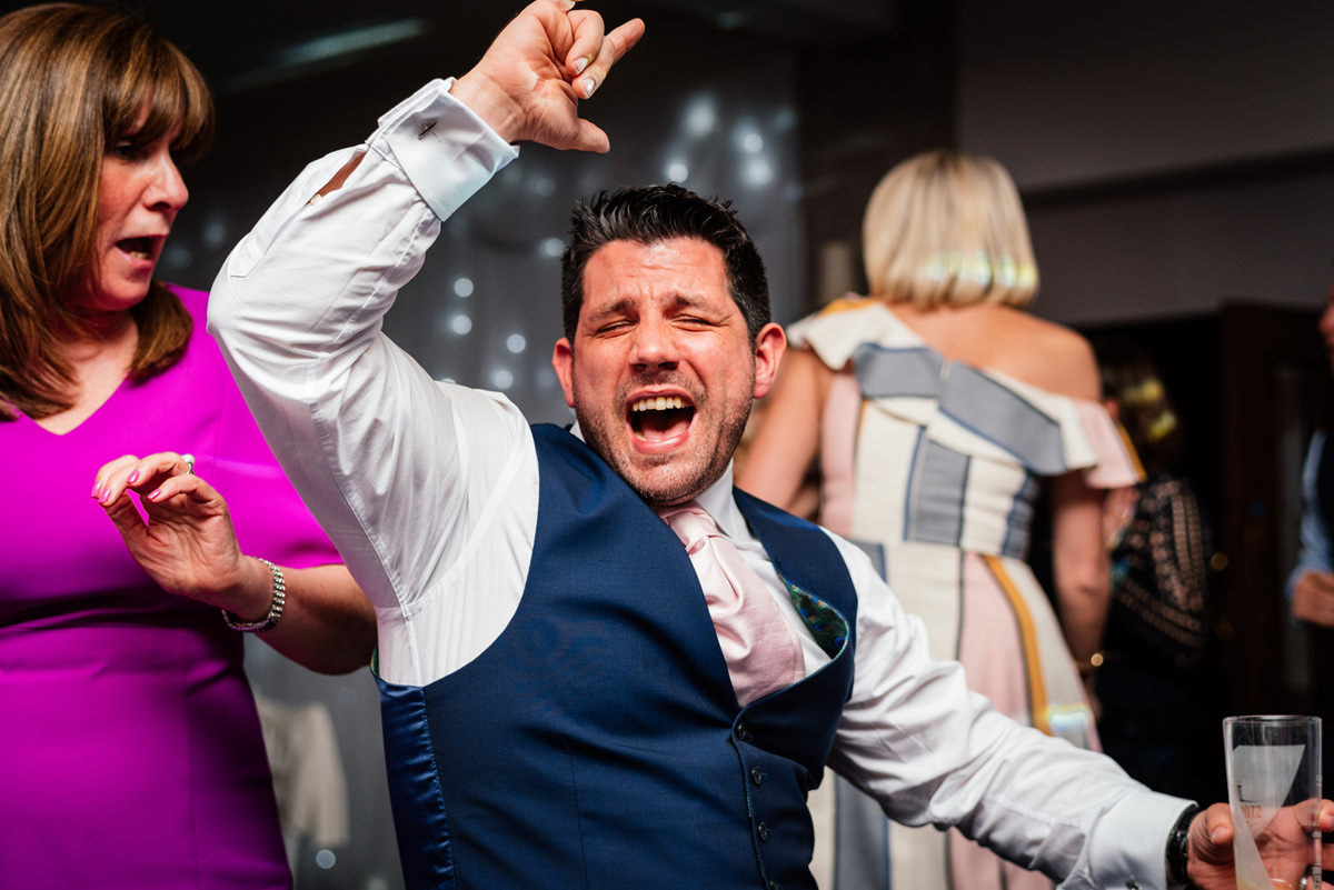 wedding guests throwing shapes