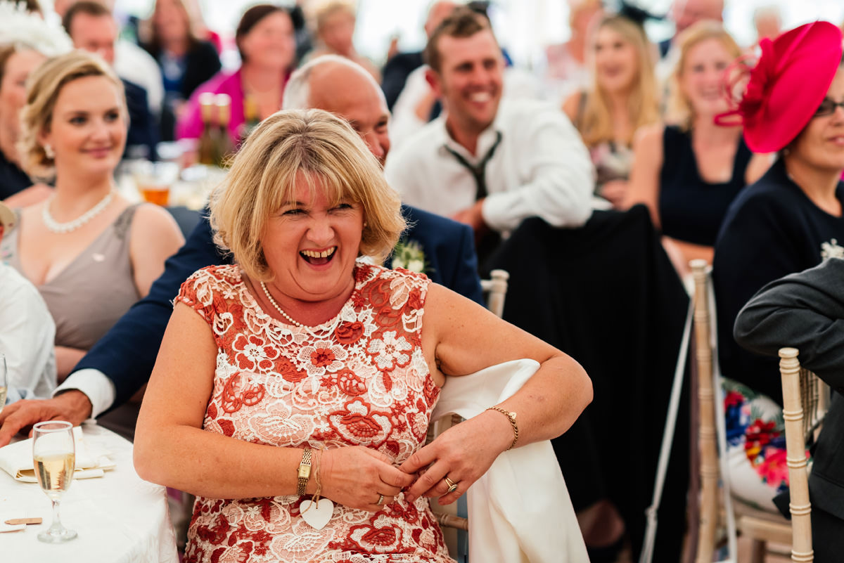 mother of the bride laughing during speeches