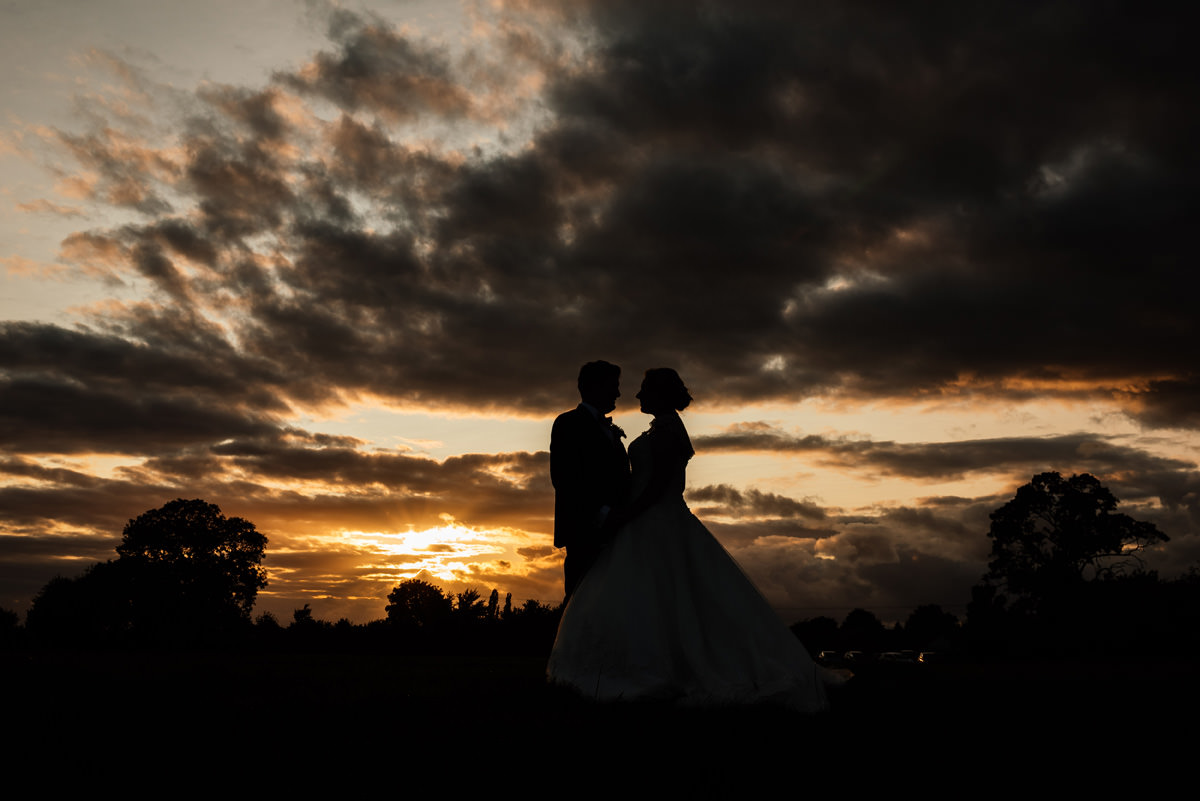 sunset portrait of bride and groom