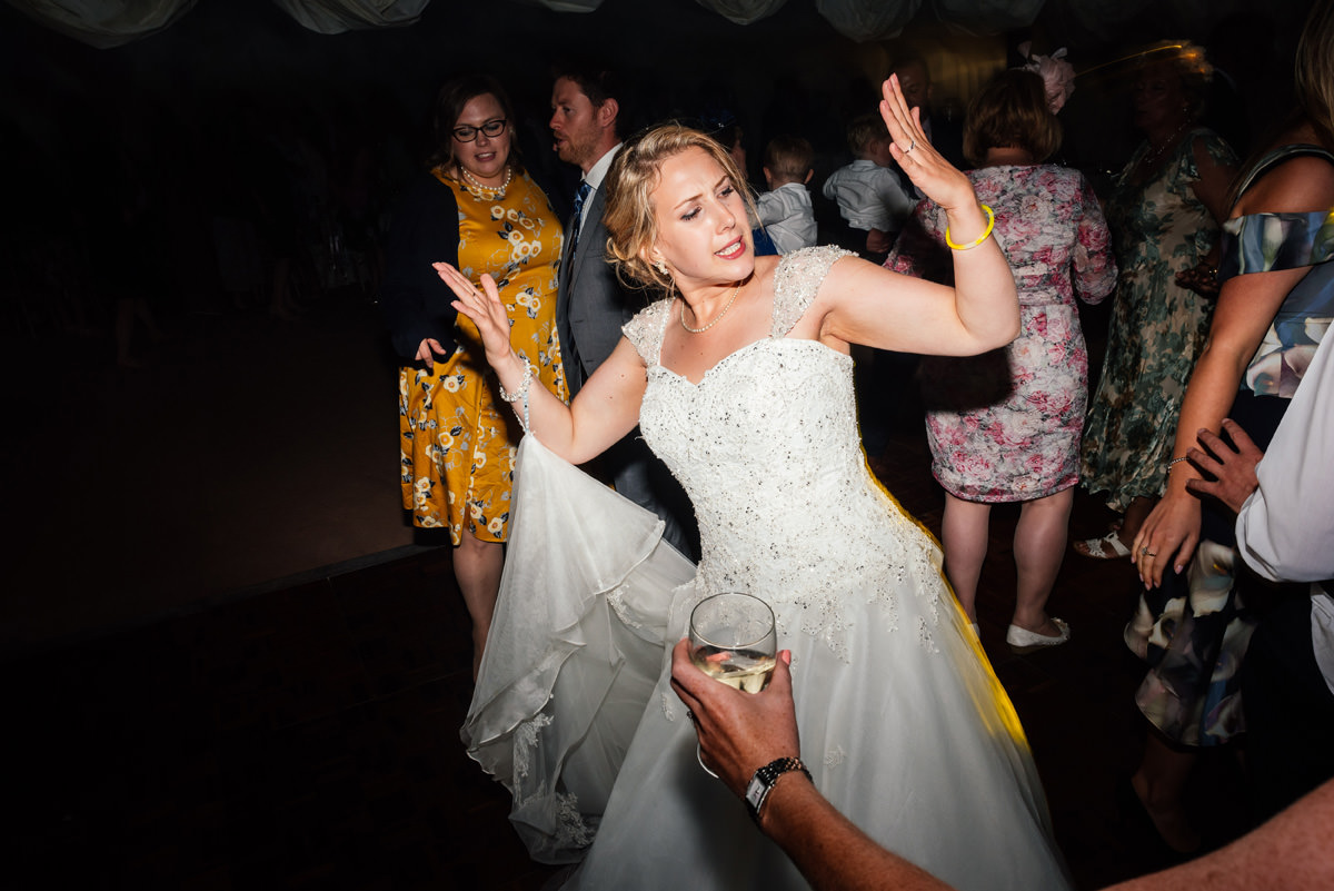 bride throwing shapes on the dance floor