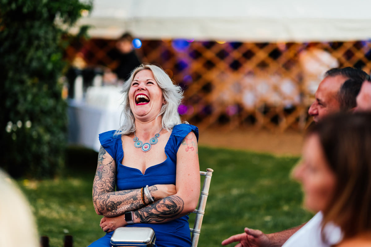 wedding guests laughing during the drinks reception