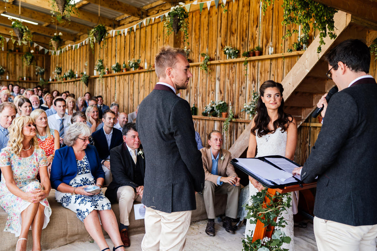 wedding ceremony takes place in the farm shed barn