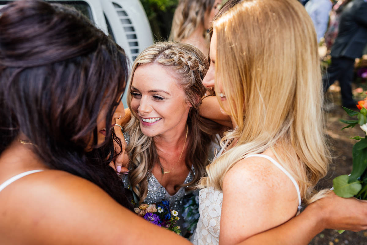 the girls hugging the bride