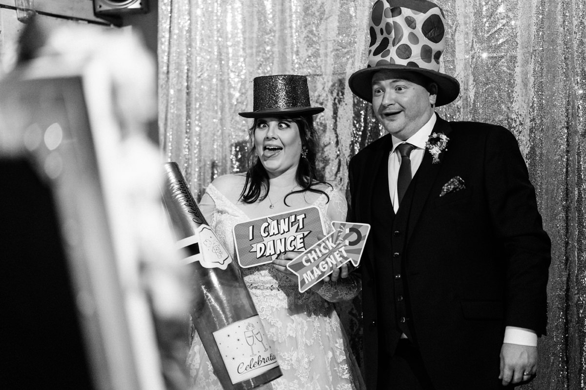 Bride and groom having fun in the Photo Booth