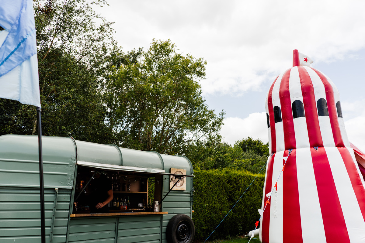 Wedding day details - horse box bar and inflatable helter skelter