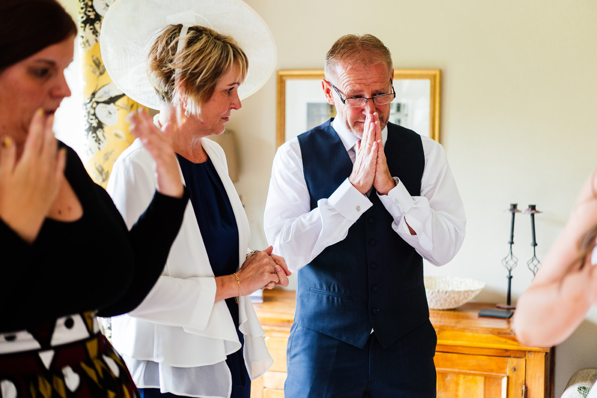 Father of the bride in tears after seeing his daughter in her wedding dress for the first time