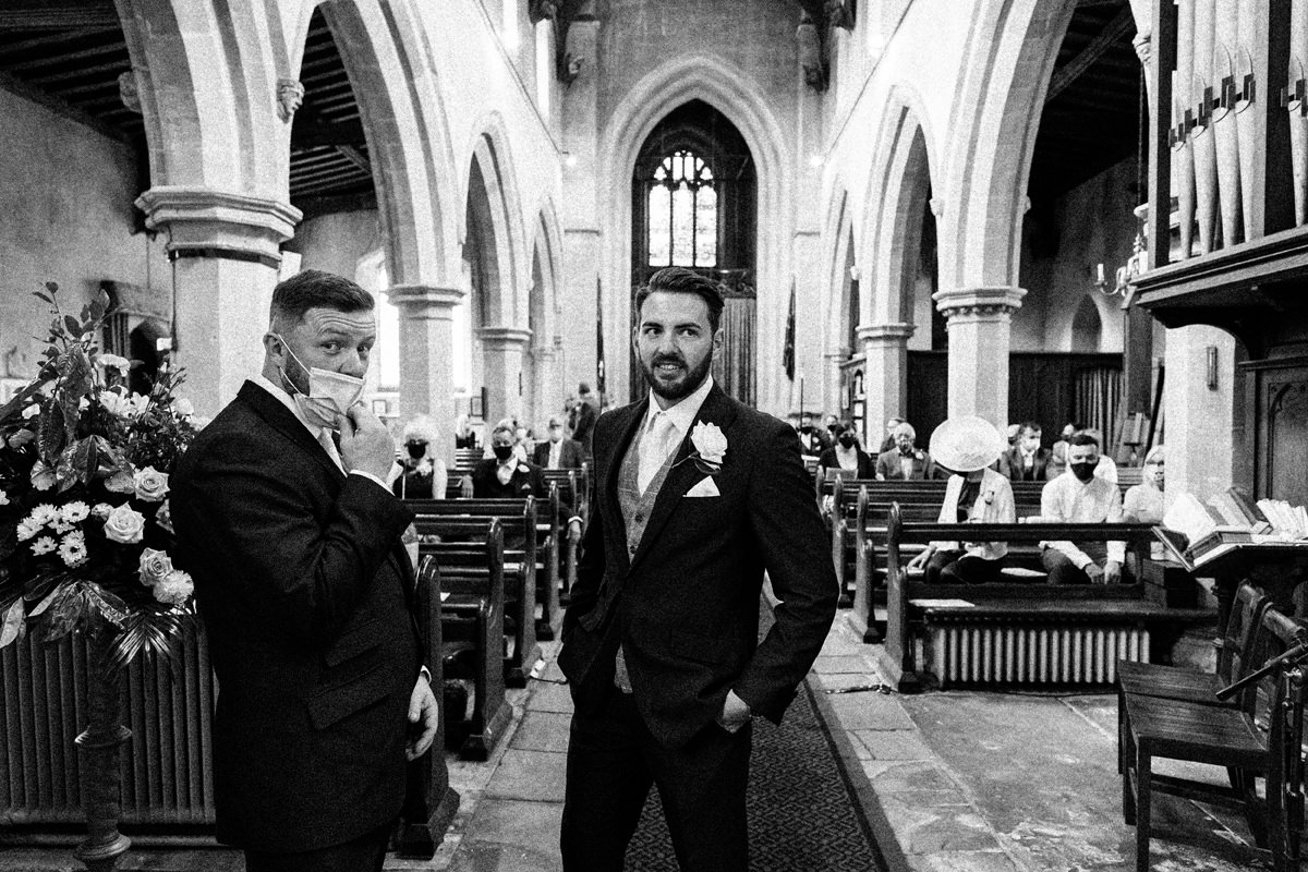 Groom and his best man waiting in the church for the arrival of the bride
